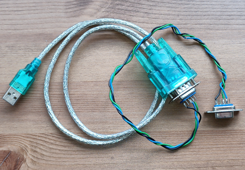 Photo of USB serial device with null modem cable made of three wires with some wire showing